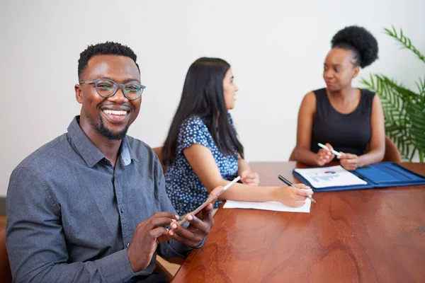 Black Businessman Smiles While Using Digital Tablet Conference Table Meeting — Foto de Stock