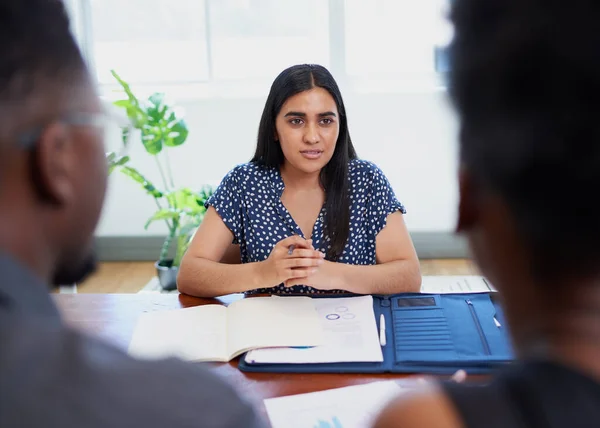 Young Indian mediator or lawyer meets with Black couple, financial advice. High quality photo