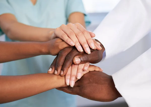 Close up of hands stacked, medical teamwork, healthcare team, doctors together. High quality photo