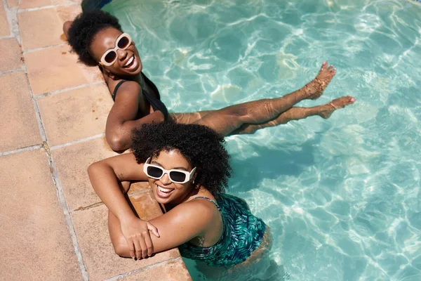 stock image Two beautiful Black women cool off in swimming pool, summer heatwave. High quality photo