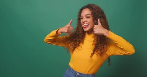 Beautiful Multi Ethnic Woman Gives Double Thumbs Green Studio Background — Stock Video