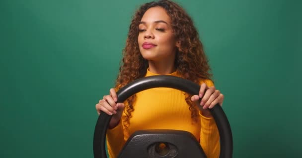 Young Woman Driver Swerves Brakes Avoid Accident Green Studio Background — Stock Video