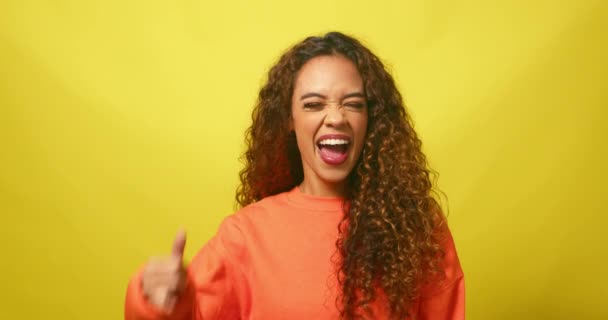 Cute Young Woman Makes Call Symbol Hand Flirting Yellow Studio — Stock Video