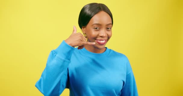 Cute Young Woman Makes Call Symbol Hand Flirting Yellow Studio — Stock Video