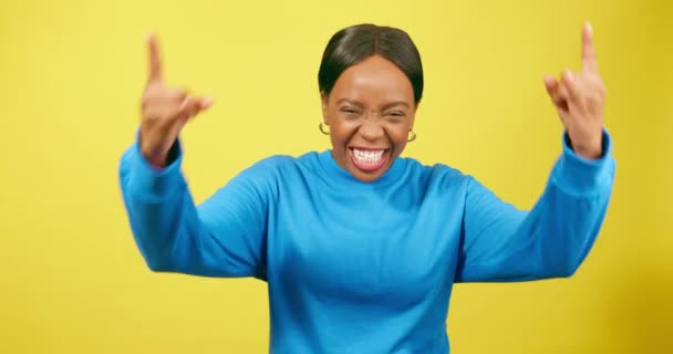Young Black Woman Dances Rock Hand Signs Laughing Yellow Studio — Stock Video