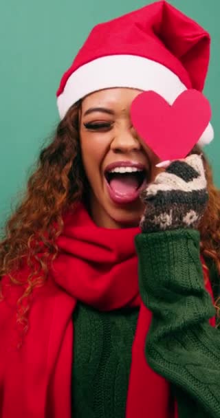 Cute Young Multi Ethnic Woman Plays Heart Shapes Christmas Studio — Stock Video