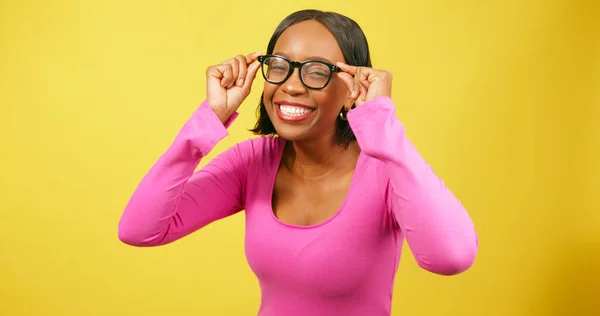Beautiful Black Woman Pulls Silly Face Trying Eyeglasses Yellow Studio — Stock Photo, Image
