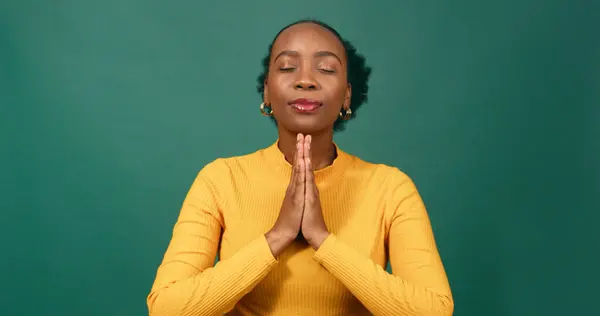 Calm Young Woman Puts Hands Prayer Position Praying Green Studio — Stock Photo, Image