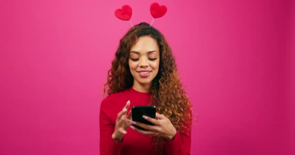 Cute Young Woman Dressed Valentines Day Swipes Dating App Cellphone — Stock Video