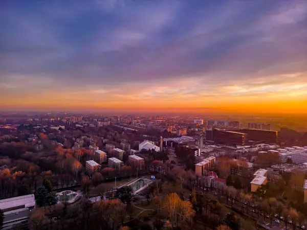 Beautiful sunset over the city. Drone photography in winter. Italy, Milan, San Donato Milanese