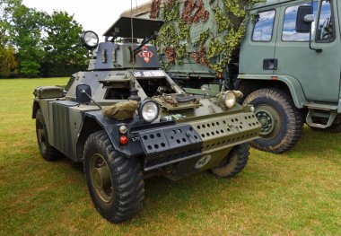 ST NEOTS, CAMBRIDGESHIRE, ENGLAND - JULY 02, 2022:  Vintage  armoured scout car parked on grass.