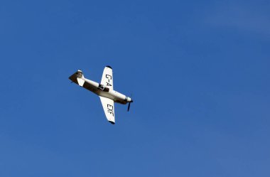 ICKWELL, BEDFORDSHIRE, ENGLAND - AUGUST 07, 2022: 1936 Percival Mew Gull  G-AEXF  Aircraft in flight with blue sky and clouds.
