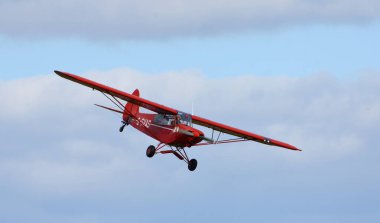 ICKWELL, BEDFORDSHIRE, ENGLAND - SEPTEMBER 06, 2020: Vintage G-SVAS PA-18 1961 Piper Super Cub  aircraft in flight. clipart
