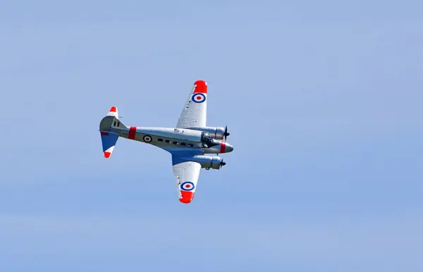 stock image ICKWELL, BEDFORDSHIRE, ENGLAND - MAY 12, 2024:  Vintage Avro C19 Anson aircraft in flight.