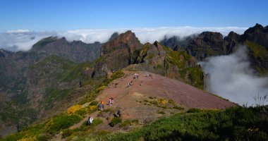 PICO DO ARIEIRO, MADERIA, PORTUGAL - JUNE 25, 2019  : Tourists at the top of Pico do Arieiro one of the highest peaks in Maderia clipart