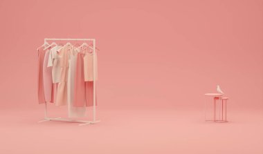 Pastel pembe arka planda koltuğu olan bir askıda asılı sonbahar giysileri. Erkek ceketi, ceket, kazak, askılarda asılı kalın gömlek. Yaratıcı bileşim.