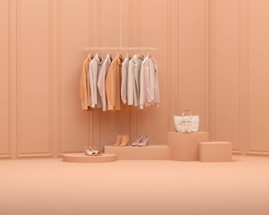 Şeftali tüyü 2024 yılının moda rengi. Pastel turuncu arka planı olan bir askıda asılı sonbahar giysileri. Ceket, kazak, askılarda asılı kalın gömlek. Yaratıcı kompozisyon. Satış konsepti