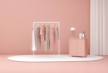Şeftali tüyü 2024 yılının moda rengi. Pastel mercan pembeli bir askıda asılı elbiseler. Oturma odasında elbise, kazak, gömlek ve kanepe. Yaratıcı kompozisyon. Satış konsepti