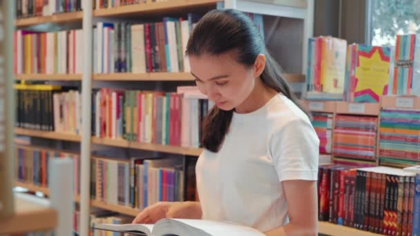 Young Woman Leafing Book Library University Public Library Office Bookshelves — Vídeo de Stock