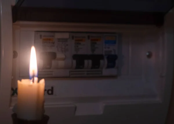 candle and electrical switches, electricity cut-off, blackout