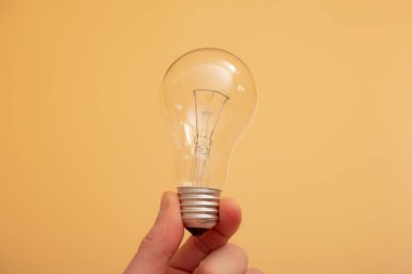 Electric light bulbs. energy efficiency concept. LED lamp vs incandescent lamp. Composition on a yellow background. Use economical light bulbs.