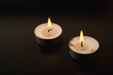 an extinguished candle, smoke from a fading overhang