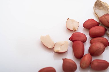 Peanut.roasted nuts,Dried peanuts crushed into many pieces close-up on a white background