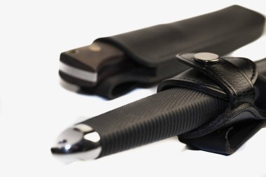 Hunting knife isolated on white background. souvenir collection dagger with a scabbard, with metal engraving, on a white background. Sharp knife blade, stainless steel knife.