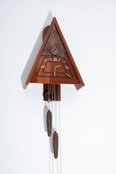 Vintage cuckoo clock isolated for creative background.cuckoo clock hanging on the wall.