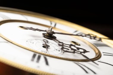 Vintage Clock with Hands. Close up view on clock face of a historical watches with golden frame