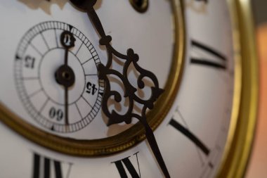 Vintage Clock with Hands. Close up view on clock face of a historical watches with golden frame