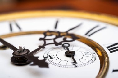 Vintage Clock with Hands. Close up view on clock face of a historical watches with golden frame
