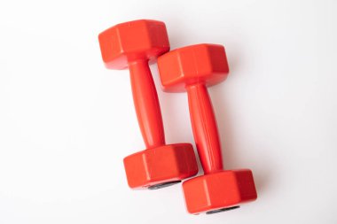Red dumbbell for fitness isolated on white background