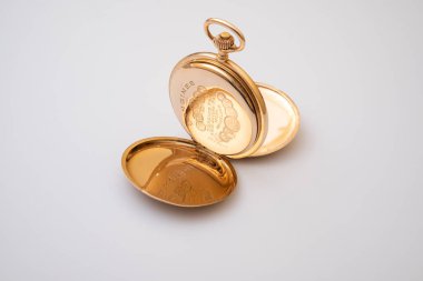 02/24/2023. Lviv, Ukraine.old gold pocket watch isolated on white background