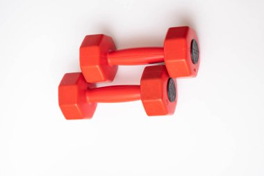 Red dumbbell for fitness isolated on white background