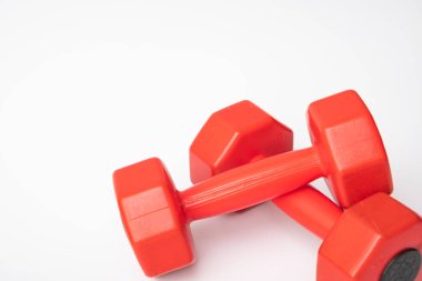 Red dumbbell for fitness isolated on white background