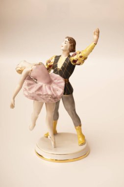 Porcelain figurine, a pair of dancing ballerinas on a white background.