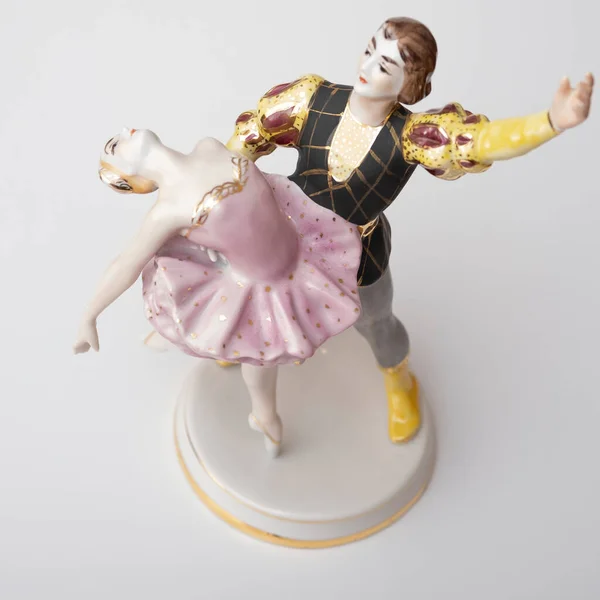 Porcelain figurine, a pair of dancing ballerinas on a white background.