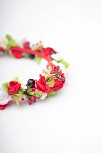 Stock image wreath with colored flowers isolated on white