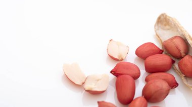 Peanuts in shell isolated on white background. Heap of peanuts close up