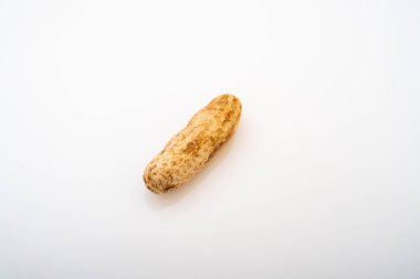Peanuts in shell isolated on white background. Heap of peanuts close up