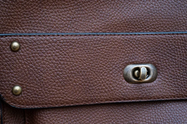 stock image Detail of a leather bag close-up. Leather metal buckle on bag macro closeup