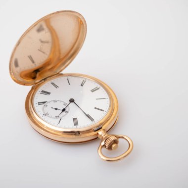 vintage gold pocket watch longines isolated on white background