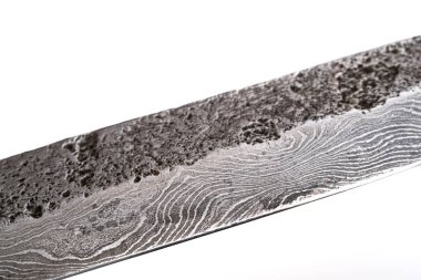 Background with a pattern of Damascus steel. Macro shot of damascusknife texture. Damascus steel with original pattern. Damascus steel pattern. clipart