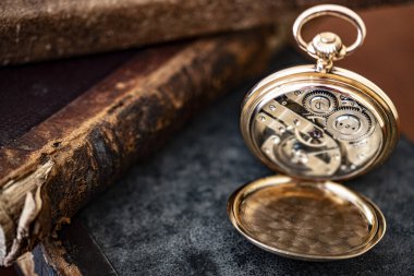 vintage gold pocket watch longines isolated on white background