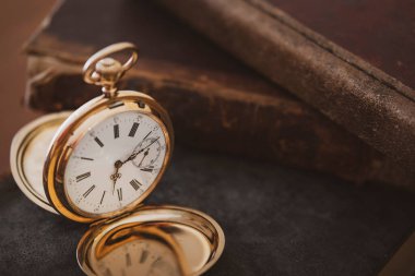 vintage gold pocket watch longines isolated on white background