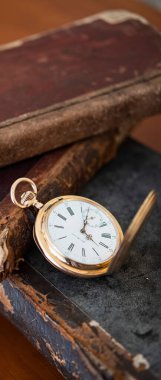 vintage gold pocket watch longines isolated on white background