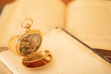 vintage gold pocket watch longines isolated on white background