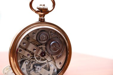 vintage gold pocket watch longines isolated on white background