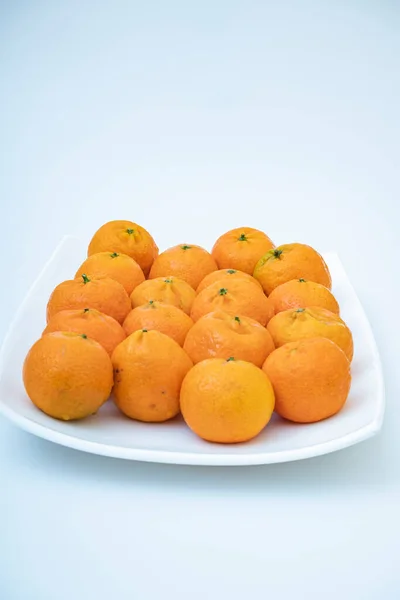 stock image tangerine on a white background. How to choose, store and how much you can eat so as not to harm the body.